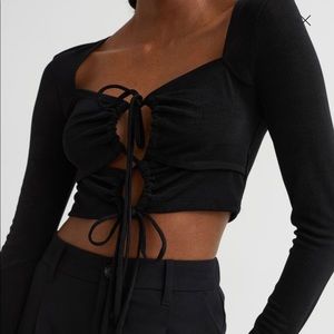 long sleeve cut out top. bought online but doesn’t fit how I want. never worn